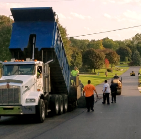 S&J Asphalt Paving Company: Asphalt Paving Contractor in Canton, MI - workers-working-at-dusk-on-a-road